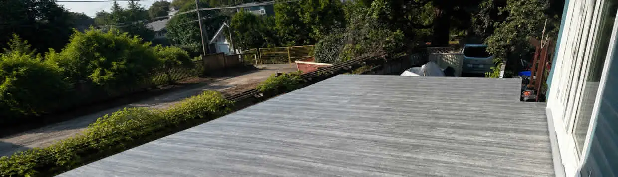 Restored Port Coquitlam deck with durable decking, waterproofing, structural repairs, stairs, and secure railings