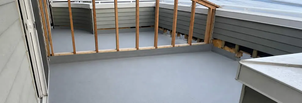 Deck builders inspecting and restoring an elevated residential deck in North Vancouver